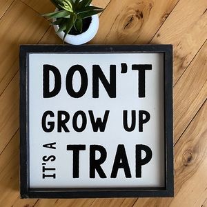 Distressed Wooden “Don’t grow up” Sign